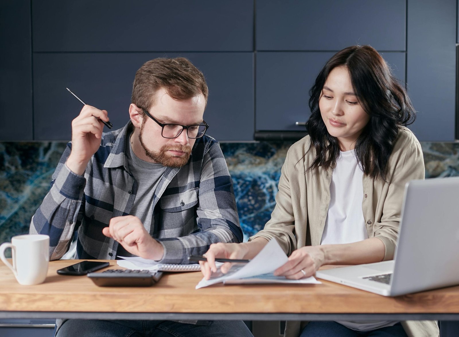 Data Entry 1 A Couple Is Reviewing And Calculating Their Household Bills Together At Home.